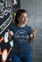 files/t-shirt-mockup-featuring-a-happy-customer-standing-by-an-art-wall-26210_2e3a8945-931a-46be-ba91-c377fac14229.png