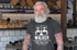 files/t-shirt-mockup-of-a-bearded-senior-with-tattooed-arms-28428.png