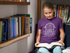files/t-shirt-mockup-of-a-girl-reading-a-book-at-a-library-a7931_e3bd7ccb-6a67-48b4-b75f-bf98f4872ead.png