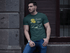products/buff-man-wearing-a-t-shirt-mockup-while-lying-against-a-wall-a17659.png