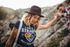 products/heathered-tee-mockup-of-a-tattooed-woman-doing-trekking-with-a-partner-m3176-r-el2.png