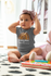 products/mockup-of-a-baby-girl-wearing-an-onesie-and-a-big-bow-m922.png