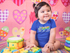 products/mockup-of-a-very-happy-baby-girl-sitting-down-on-her-playing-room-while-wearing-a-onesie-a14052.png