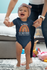 products/onesie-mockup-featuring-a-happy-baby-girl-learning-to-walk-m926.png