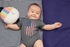 products/onesie-mockup-of-a-baby-boy-lying-on-a-blanket-30016.png