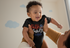 products/onesie-mockup-of-a-joyful-baby-being-lifted-by-his-mother-25120.png