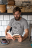 products/ringer-tee-mockup-featuring-a-hipster-man-reading-at-a-bakery-27914_cc9363dc-48e3-4a5b-aab0-19879c6b57cc.png