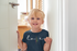 products/round-neck-t-shirt-mockup-of-a-little-girl-smiling-at-home-m19575-r-el2.png