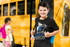 products/round-neck-tee-mockup-of-a-smiling-boy-posing-in-front-of-a-school-bus-m18307-r-el2.png
