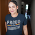 products/t-shirt-mockup-being-worn-by-a-middle-aged-hispanic-woman-smiling-while-in-a-hallway-a16017.png