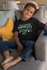 products/t-shirt-mockup-featuring-a-smiling-kid-sitting-on-a-couch-31639_1981d51c-f158-420d-bf70-bc48cfd6e232.png