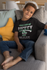 products/t-shirt-mockup-featuring-a-smiling-kid-sitting-on-a-couch-31639_653fc71c-862d-437d-9c23-1d18af8d1ed5.png