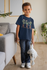 products/t-shirt-mockup-of-a-boy-with-a-coy-smile-holding-a-cuddly-toy-31637.png