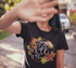 products/t-shirt-mockup-of-a-happy-girl-blocking-the-camera-with-her-hand-20567.png