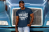 products/t-shirt-mockup-of-a-man-leaning-against-a-blue-truck-29477.png