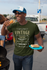 products/t-shirt-mockup-of-a-man-with-a-trucker-hat-eating-at-a-tailgate-party-29893_4e6c2265-e7d4-43e2-8f5c-809847c27f60.png