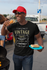 products/t-shirt-mockup-of-a-man-with-a-trucker-hat-eating-at-a-tailgate-party-29893.png