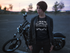 products/t-shirt-mockup-of-a-short-hair-biker-girl-at-a-parking-lot-with-her-bike-20257.png