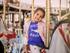products/t-shirt-mockup-of-a-smiling-little-girl-on-a-carousel-horse-22528.png