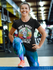products/t-shirt-mockup-of-a-smiling-woman-doing-a-leg-workout-at-a-gym-m21040-r-el2.png