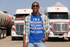 products/t-shirt-mockup-of-a-truck-driver-posing-in-front-of-two-trucks-29460_b5071f85-88af-469d-9f4b-64d95bb52789.png