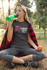 products/t-shirt-mockup-of-a-woman-at-the-park-drinking-water-32244.png