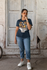 products/t-shirt-mockup-of-a-young-woman-posing-outside-of-an-old-house-m26133.png