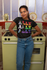products/tee-mockup-of-a-girl-with-locks-posing-in-front-of-a-vintage-kitchen-24092_cd12b256-2e67-4c06-a521-c1e69117b974.png