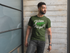 products/front-view-t-shirt-mockup-featuring-a-man-with-a-beard-against-a-concrete-wall-and-a-window-21352_ffc2a964-8102-4e2d-96c3-c8a05f850c81.png