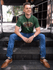 products/happy-guy-wearing-a-tshirt-template-while-sitting-on-steps-outdoors-a17850.png