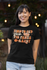 products/mockup-of-a-happy-woman-wearing-a-bella-canvas-t-shirt-with-lights-in-the-background-m24743_9ee4b09d-ee87-4fe0-b85a-b92a0755321d.png