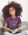 products/mockup-of-a-little-black-girl-wearing-a-t-shirt-while-reading-a21320.png