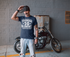 products/mockup-of-a-tshirt-being-worn-by-a-biker-using-a-bandana-in-front-of-his-motorcycle-20254.png