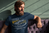 products/ringer-t-shirt-mockup-featuring-a-cool-bearded-man-sitting-on-a-purple-couch-27931_5d652ef0-684e-455a-a02b-cbe6190c4672.png