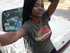 products/selfie-of-a-pretty-black-girl-with-dreadlocks-wearing-a-round-neck-tee-mockup-next-to-an-old-car-a17187.png