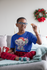 products/t-shirt-mockup-featuring-a-kid-with-glasses-at-a-xmas-decorated-living-room-30342.png