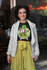 products/t-shirt-mockup-featuring-a-middle-aged-woman-with-curly-hair-by-a-restaurant-window-31613.png