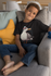 products/t-shirt-mockup-featuring-a-smiling-kid-sitting-on-a-couch-31639_17cc119e-36a9-46bd-88a0-ba33e589902a.png