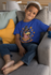 products/t-shirt-mockup-featuring-a-smiling-kid-sitting-on-a-couch-31639_fcf3c993-8b84-48c3-bac6-c4e119c77e2d.png