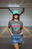 products/t-shirt-mockup-featuring-a-woman-with-a-hat-on-a-parking-garage-28609.png