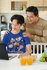 products/t-shirt-mockup-featuring-a-young-boy-using-a-laptop-with-his-father-standing-behind-him-m11569-r-el2.png