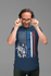 products/t-shirt-mockup-of-a-man-holding-his-glasses-at-a-studio-28436.png