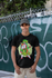 products/t-shirt-mockup-of-a-smiling-man-wearing-a-dad-hat-against-a-graffiti-fence-31164.png
