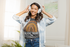 products/t-shirt-mockup-of-a-woman-happily-listening-to-music-at-home-43895-r-el2.png