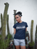 products/woman-wearing-a-round-neck-t-shirt-mockup-while-near-cactus-plants-a17209.png