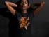 products/young-black-girl-looking-to-the-camera-while-wearing-a-tshirt-mockup-a16070.png